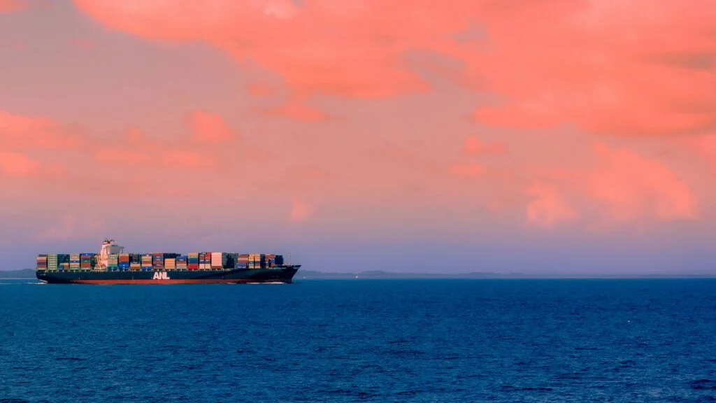 Cargo ship navigating a maritime waterway